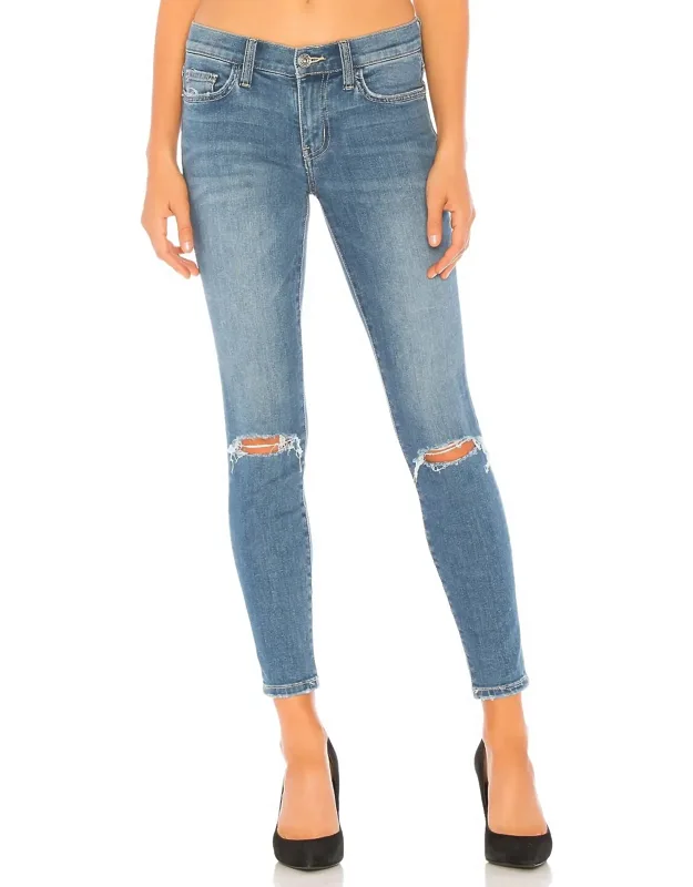 The Stiletto Jean With Fading And Whiskering Detail And Intentionally Destroyed Areas