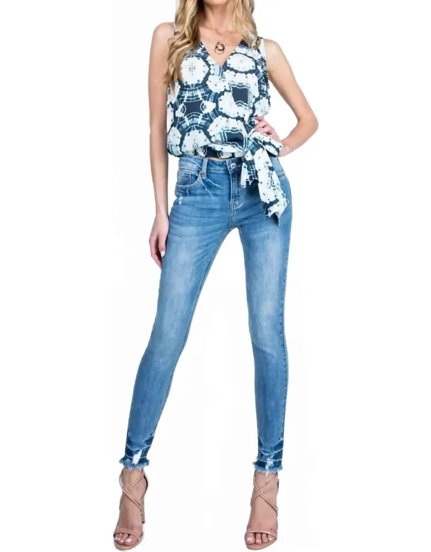 Mid Rise Raw Hem Skinny Jeans