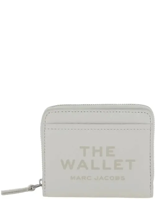 Mini Compact Wallet With Embossed Logo In Hammered Leather
