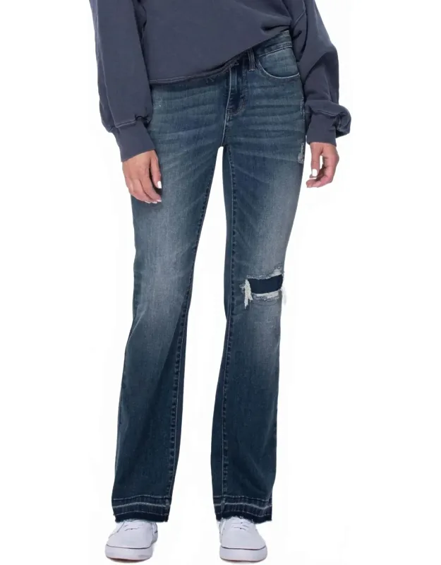 Mid Rise Bootcut Patched Distressed Knee Raw Hem Jeans
