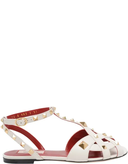 Sandals With Studs And Lateral Buckle Closure