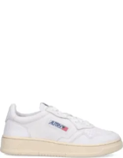 Leather Sneakers With Intricate Perforated Detailing And Slightly Off-white Rubber Sole