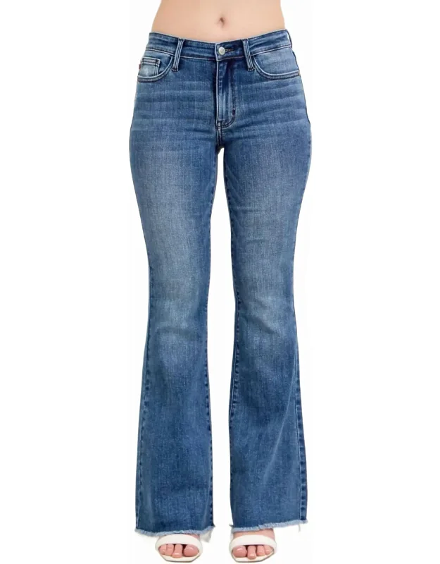 Mid Rise Vintage Wash Flare Jeans With Distressed And Fray Hem