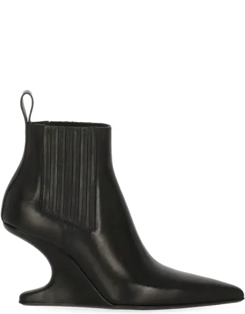 Sculptural Leather Heeled Boots With Arrowhead Design