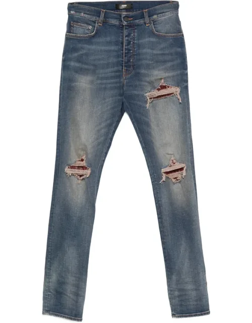 Amiri Jeans With Whiskering Effect And Distressed Finish