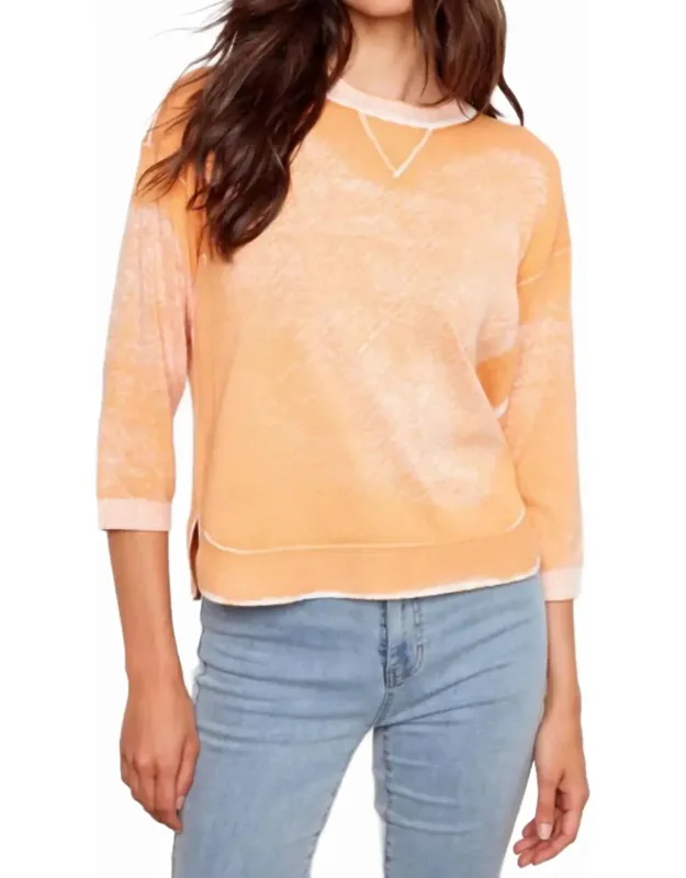 Reversed 3/4 Sleeve Knit Top With Curved Hem
